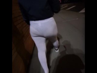 See through white leggings walking through city in public