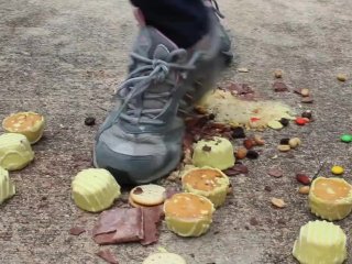 MILF crushes food under her heels outdoors