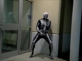 nighttime skeleton jerking off in front of outside doors