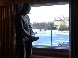 Dawn of the dead morphsuit in window cums into black rubber cock extender