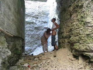 brunette sucks cock in the ruins of an old fortress