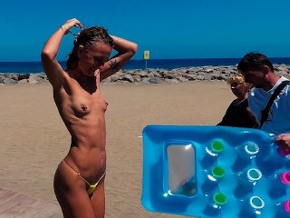 TRAVEL NUDE - Girl with small tits topless in shower on the public beach