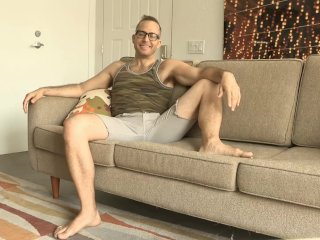 Joel starts jacking his cock as he bends over the sofa