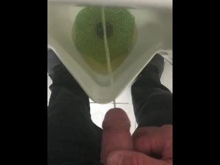 Pissing in a urinal in public at work