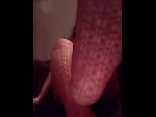 Feet in red fishnets