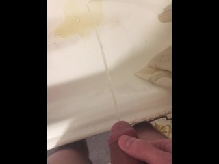 Russian guy pissing in the bath closeup