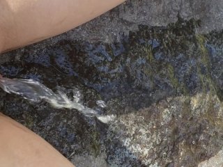 Petite Girl Sits On Rock To Take A Piss
