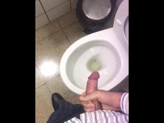 Jerking off in a public toilet. Almost caught by the cleaner!