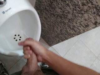 Cumming at public urinal