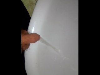 Chubby boy piss in a sink