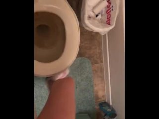 Petite Sabrina pulls her thong to the side and pees in the toilet