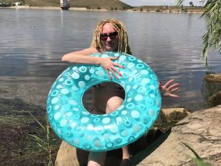 Inflating a swimming ring on the lake