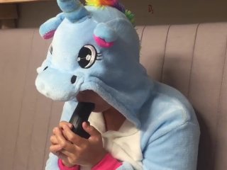 Girl in unicorn onesie gagging on dildo