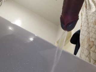 Point of view from the bottom of my cock. Pissing in bathtub.