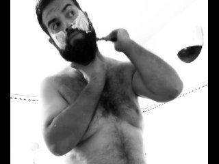 Big Italian daddy bear with very hairy chest shaves his beard before taking a shower