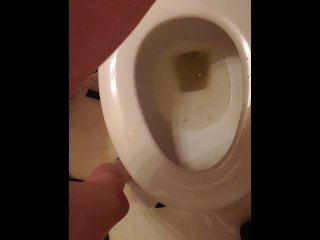 Golden stream. Peeing in toilet. Up close