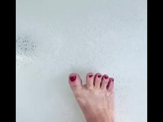 Cute toes in a bubble bath