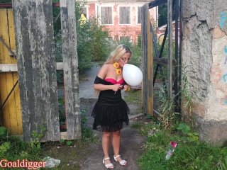 Blowing balloons near old manor in big eye glasses. Full Video in Fan Club.