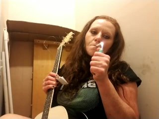 Getting ready to play my guitar while smoking