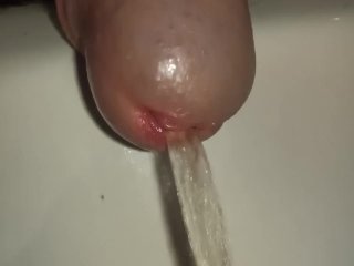 Pissing cock, extreme close up