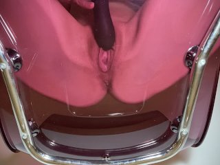 pussy playing on my pink glass chair
