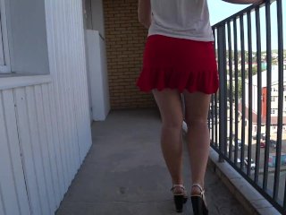 Slim girl with a beautiful booty takes off her panties on a public balcony Upskirt