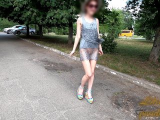 Slut walks in a mini dress with a fully transparent skirt