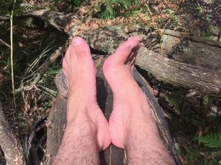 In the deep bush land where no one goes is a man playing with his extra long toes - MANLYFOOT