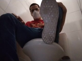 seated in the public toilet to show my dirty shoes