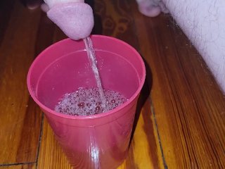 Teen fills cup with piss