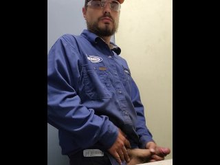 Blue collar worker strokes cock on the clock
