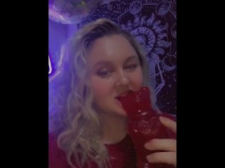 seductive teen takes a bite out of a giant gummy bear