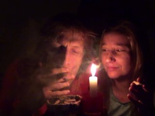 Couple smoking next to candle