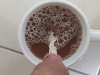 Piss into a cup with juice and making it overflow 