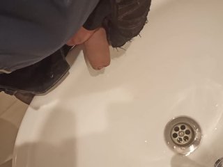 Guy pisses in the sink