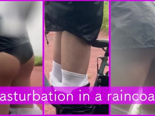Exposed masturbation wearing a raincoat outside on a rainy day