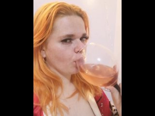 red-haired sexy girl drink vine and dream aboyte you