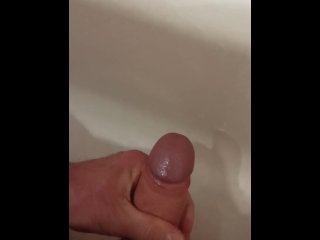 Jerking off dick and cumming in the bathroom.