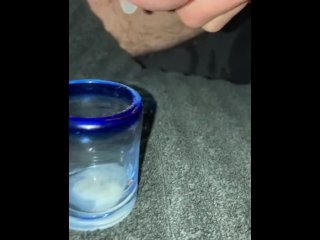 Trying to milk my cum into a shot glass while filming, failed a little bit on aiming