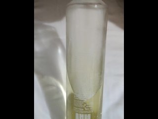 Relaxing piss into glass bottle
