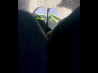 Two socked feet rub against one another - SFW