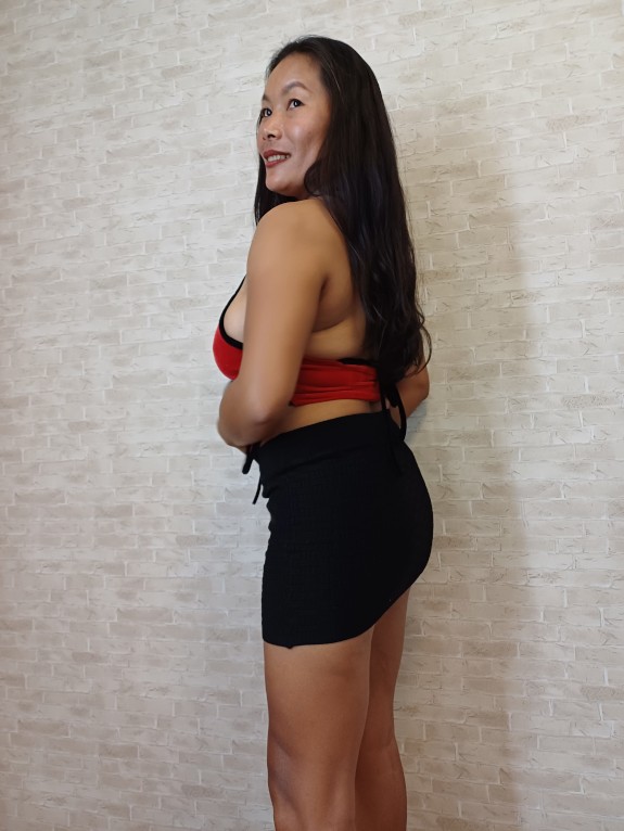 Thaiger Posing in a Red Top with a Tight Black Skirt