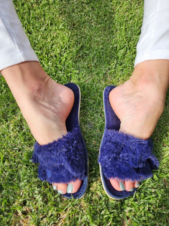 Sexy female feet in slippers