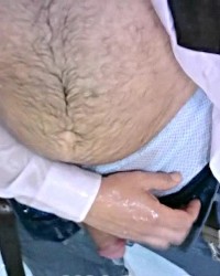 mojado y orinado de traje y corbata y pantalon, en la bañera, polla y huevo photo