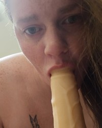 Sucking the dildo photo
