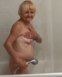 Petite Mila loves playing with water photo