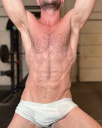 Garage workout.  Sweat muscle and cock. photo
