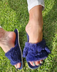 Sexy female feet in slippers photo