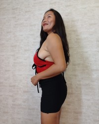Thaiger Posing in a Red Top with a Tight Black Skirt photo
