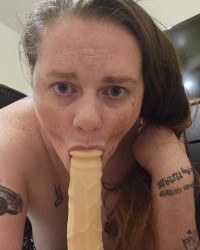 Sucking the dildo photo
